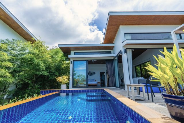 Blue-tiled pool in front of a modern pool villa at Pahili, Chaloklum